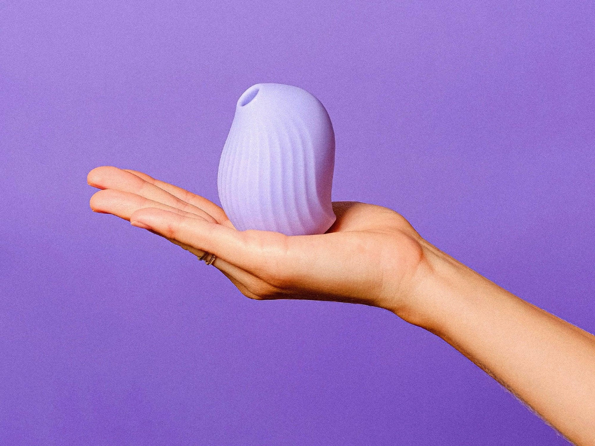 An image of a purple clitoral suction stimulator from Little Miss Vanilla.