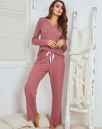 Women's waffle long sleeve pajama suit in cameo red, suitable for home relaxation and outdoor use.