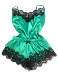 Women's green satin pajama set with black lace trim, stylish and comfortable sleepwear for relaxing nights.