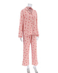 Soft pink cotton pajamas suit with heart prints, featuring long sleeves and trousers. Ideal for comfortable sleepwear.