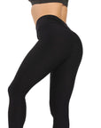 Seamless black nylon moisture-wicking yoga leggings designed for fitness and hip lift support.