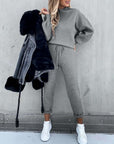 Casual high neck long sleeve grey pocket trousers two-piece suit with fur jacket and white sneakers.