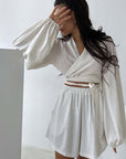 Fashion sexy pajama set in white, featuring a wrap top and shorts, perfect for casual and comfortable wear.