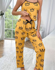 Two-piece milk silk suspender pajamas in yellow with crown print, perfect for casual wear and comfortable lounging.