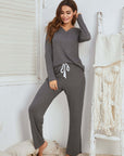 Medium gray waffle long sleeve pajamas set for women, featuring a comfortable v-neck top and stylish drawstring pants.