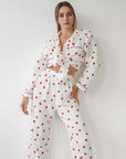 Comfortable soft heart-printed cotton pajamas set in white, featuring long sleeves and trousers.