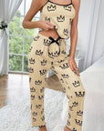 Two-piece milk silk suspender pajamas in beige with crown print, perfect for casual and comfortable wear at home.